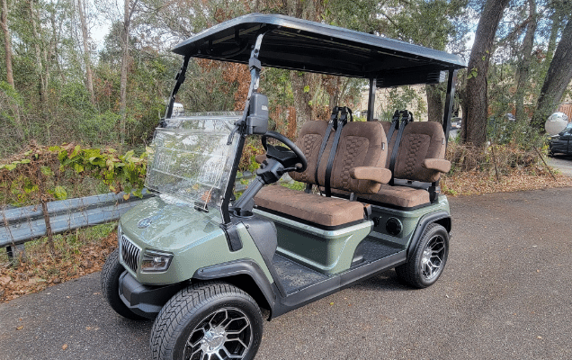 Green golf cart with cushioned ergonomic seats